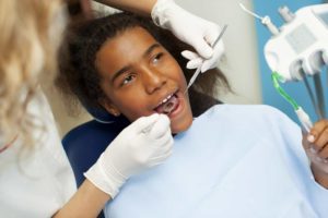 boy undergoing a dental exam